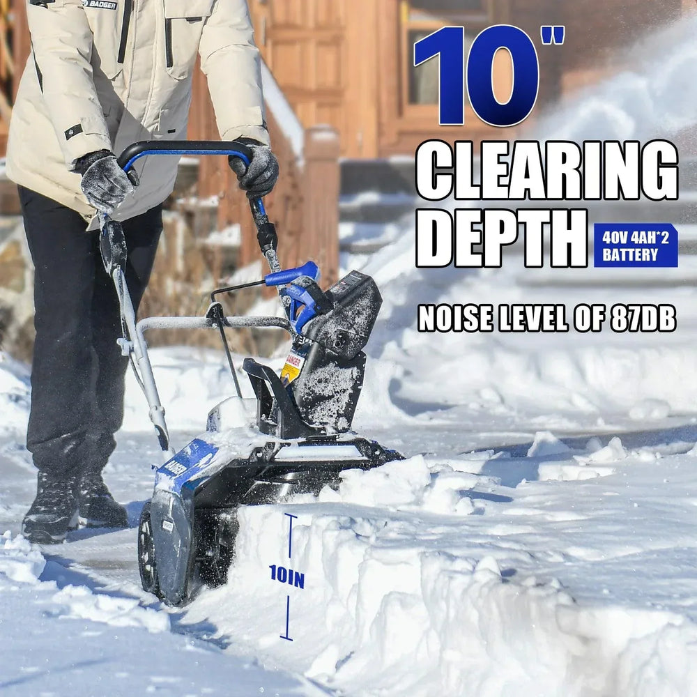 A cordless snow blower clearing snow on a rural road, showcasing its versatility in industrial and residential settings.