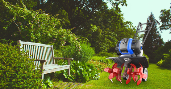 Using a gas garden tiller to prepare soil for planting in a large garden.